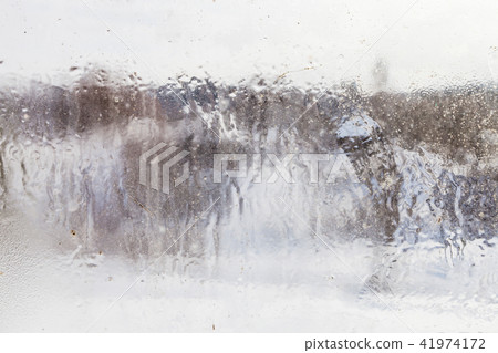blurry view of village through frozen window blurry view of village through frozen window 41974172
