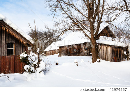 snowy yard in abandoned russian village in winter 41974367