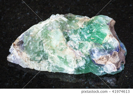 raw green Beryl crystals on black raw green Beryl crystals on black 41974613