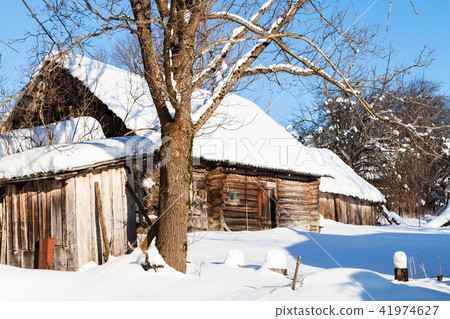 old abandoned rural house in sunny winter day old abandoned rural house in sunny winter day 41974627