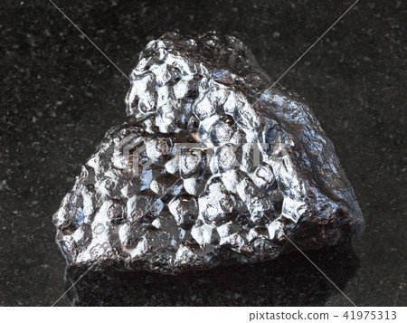 raw Hematite (Kidney Ore) stone on black raw Hematite (Kidney Ore) stone on black 41975313