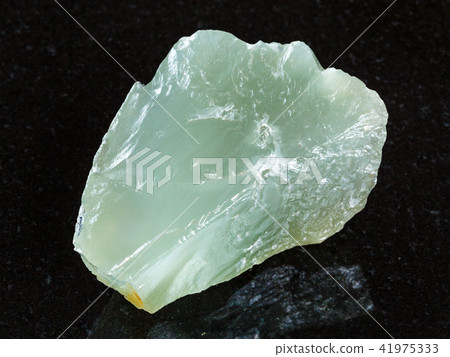 raw Prase (green quartz) stone on black 41975333