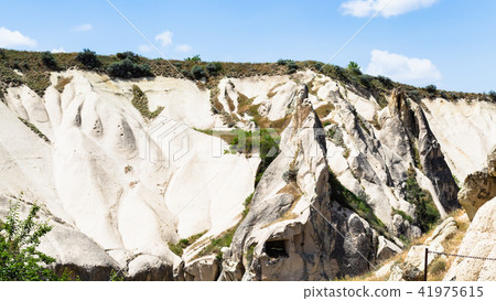 slope of valley with ancient caves near Goreme slope of valley with ancient caves near Goreme 41975615
