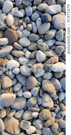 smooth beach stones background 41975879