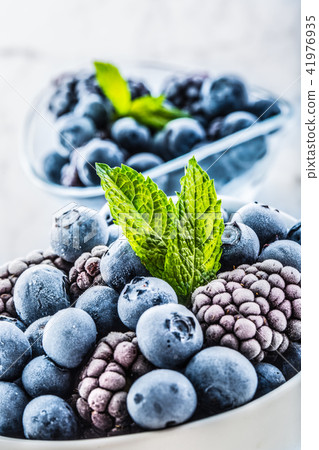 Frozen blueberries and blackberries with mint herb 41976935