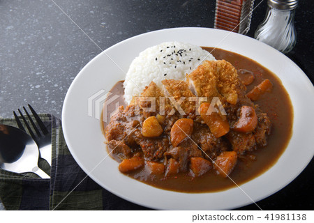 Japanese curry rice and fried pork. Japanese curry rice and fried pork. 41981138
