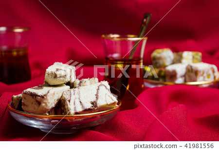 Halva with cacao and tea on a plate Halva with cacao and tea on a plate 41981556