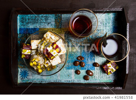Halva with cacao pieces on a plate 41981558