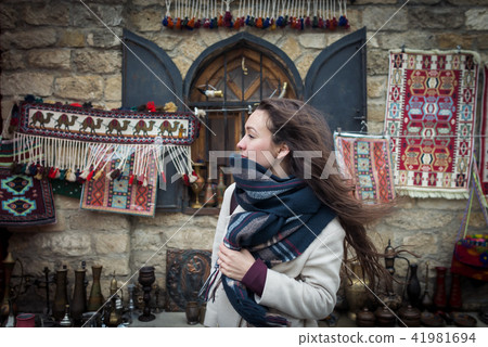 Curious traveler explores authentic oriental bazaar in Central Asia Curious traveler explores authentic oriental bazaar in Central Asia 41981694
