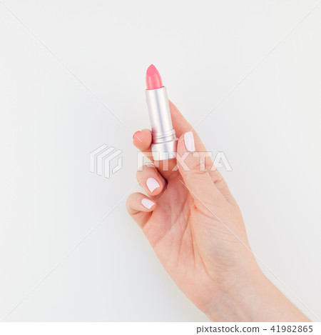 Woman hand with pink lipstick 41982865