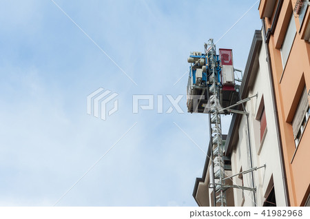 Elevator construction attached to the wall. Elevator construction attached to the wall. 41982968