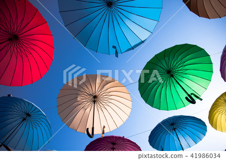 Colorful umbrellas background. Colorful umbrellas in the sky. 41986034