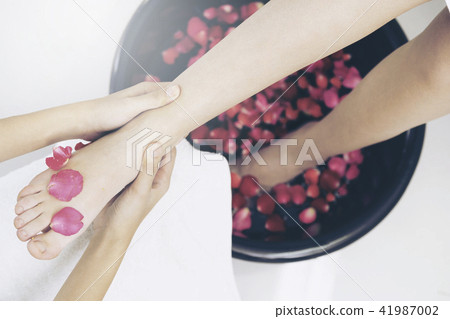 Foot spa massage treatment in luxury spa resort. Foot spa massage treatment in luxury spa resort. 41987002
