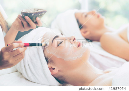 Beautiful woman having a facial treatment at spa. 41987054