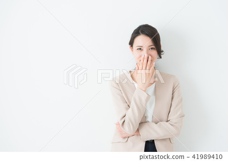 Business woman smiling on white background Business woman smiling on white background 41989410