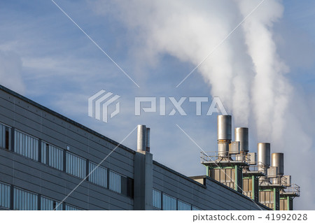 Iindustrial building with smoking chimneys 41992028