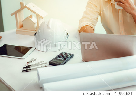 Close up portrait of civil engineer using laptop Close up portrait of civil engineer using laptop 41993621