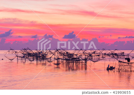 sunshine on  fishing trap at Pak Pra in Talay Noi 41993655