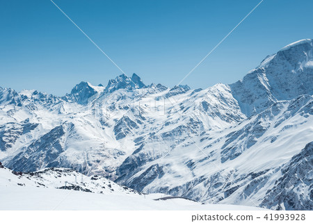 Winter snow covered mountain peaks in Caucasus. Great place for winter sports Winter snow covered mountain peaks in Caucasus. Great place for winter sports 41993928
