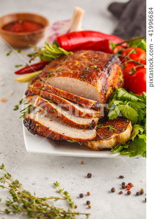 Roasted pork with thyme, rosemary, garlic on a 41996684