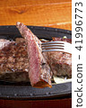 Lifting the sirloin steak 41996773