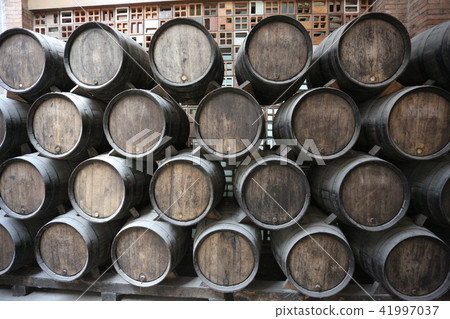 Old barrels for aging wine in the cellar Old barrels for aging wine in the cellar 41997037