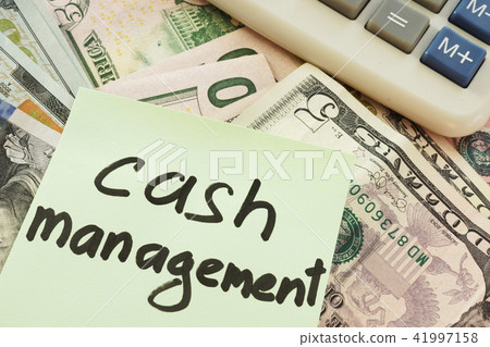 Cash management written on a memo stick and money. Cash management written on a memo stick and money. 41997158