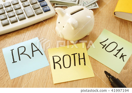 Memo sticks with words IRA 401k ROTH.  41997194