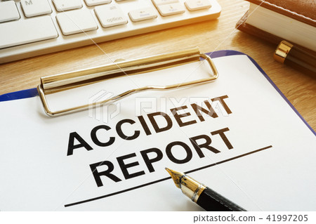 Accident report and pen on a desk. Accident report and pen on a desk. 41997205
