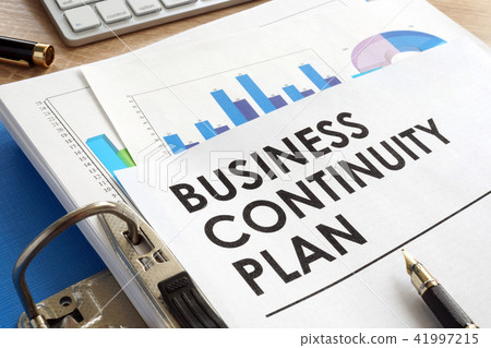 Business continuity plan in a blue folder. Business continuity plan in a blue folder. 41997215