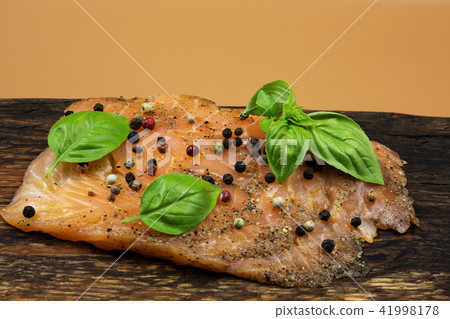 Smoked salmon on a wooden board Smoked salmon on a wooden board 41998178
