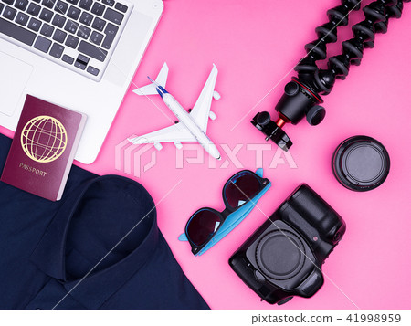 flat lay top view of traveler photographer accessories on pink background flat lay top view of traveler photographer accessories on pink background 41998959