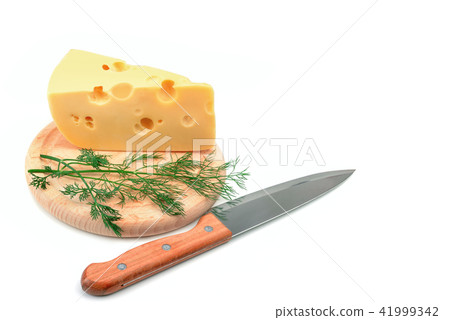 A slice of cheese on a kitchen board isolated A slice of cheese on a kitchen board isolated 41999342
