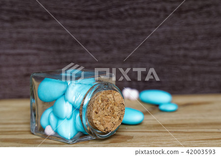 Decorative jar with bow and blue stones Decorative jar with bow and blue stones 42003593