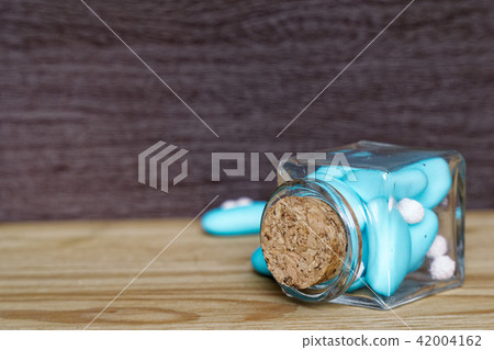 Decorative jar with bow and blue stones Decorative jar with bow and blue stones 42004162