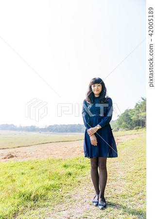 Asian Taiwan Hsinchu Qingqing grassland female portrait portrait dress grassland character model one person 42005189