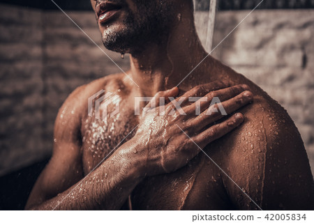 Close up. Young Afro-American Man Taking Shower. 42005834