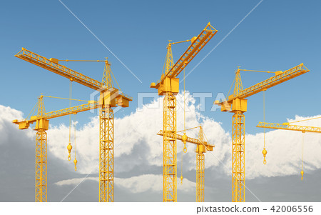 Construction cranes against a blue sky with clouds 42006556