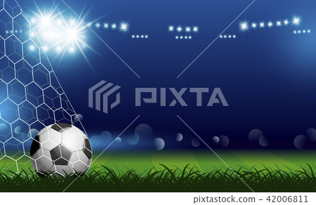 Soccer ball in goal on grass with spotlight Soccer ball in goal on grass with spotlight 42006811