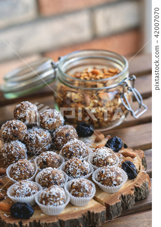 Raw vegan candies c with dried fruit and coconut. Selective focus Raw vegan candies c with dried fruit and coconut. Selective focus 42007070