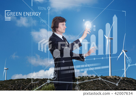 Businessman and a windfarm Businessman and a windfarm 42007634