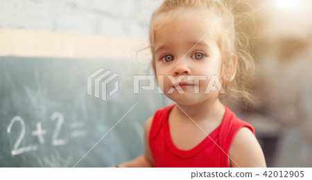 happy school girl on math classes 42012905