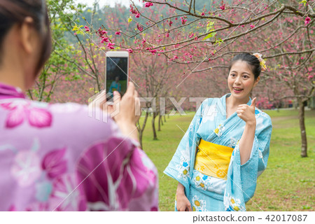 lady posing a thumb and take a picture lady posing a thumb and take a picture 42017087