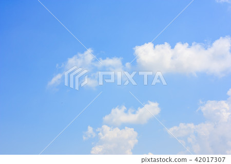 Fluffy cloud against blue sky background Fluffy cloud against blue sky background 42017307