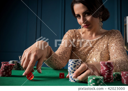 Woman playing in casino Woman playing in casino 42023000