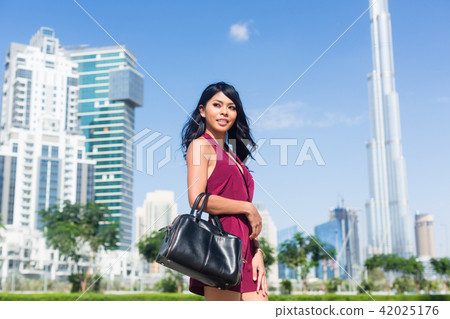 Tourist woman on city vacation in Dubai Tourist woman on city vacation in Dubai 42025176