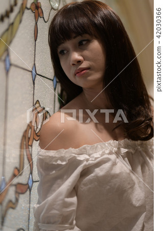 A young woman's upper body bounces down 42030366