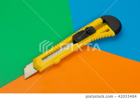 Paper knife on colored cardboard 42033484