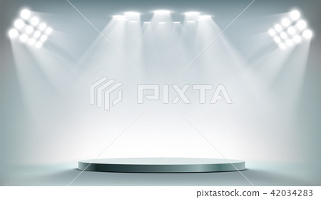 Round podium illuminated by searchlights. 42034283