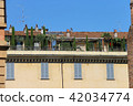 Picturesque old building with trees on terrace  42034774